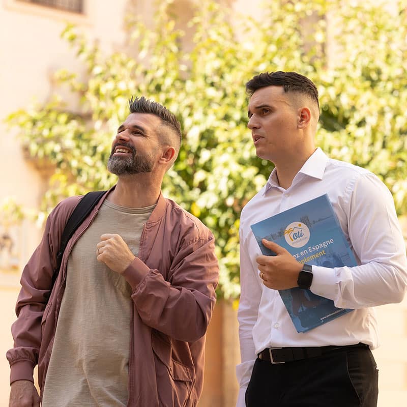 Advisor accompanying a client during a property visit in Spain