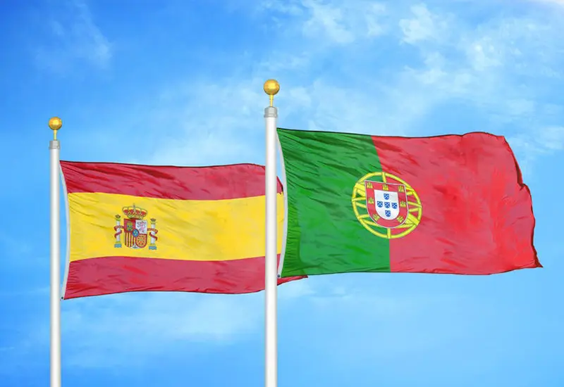 Flags of Spain and Portugal side by side, illustrating cost of living comparison between both countries