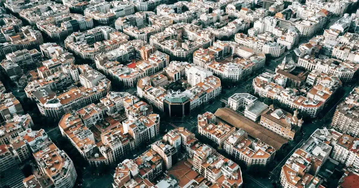 Aerial view of Barcelona symbolizing the comparison of square meter real estate prices in Spain and France
