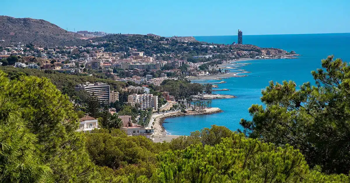 Panoramic view of the Spanish coastline with beaches and houses, representing seaside real estate in Spain in 2025